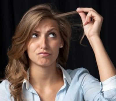 woman having hair problems because of hard water - Ensor Plumbing